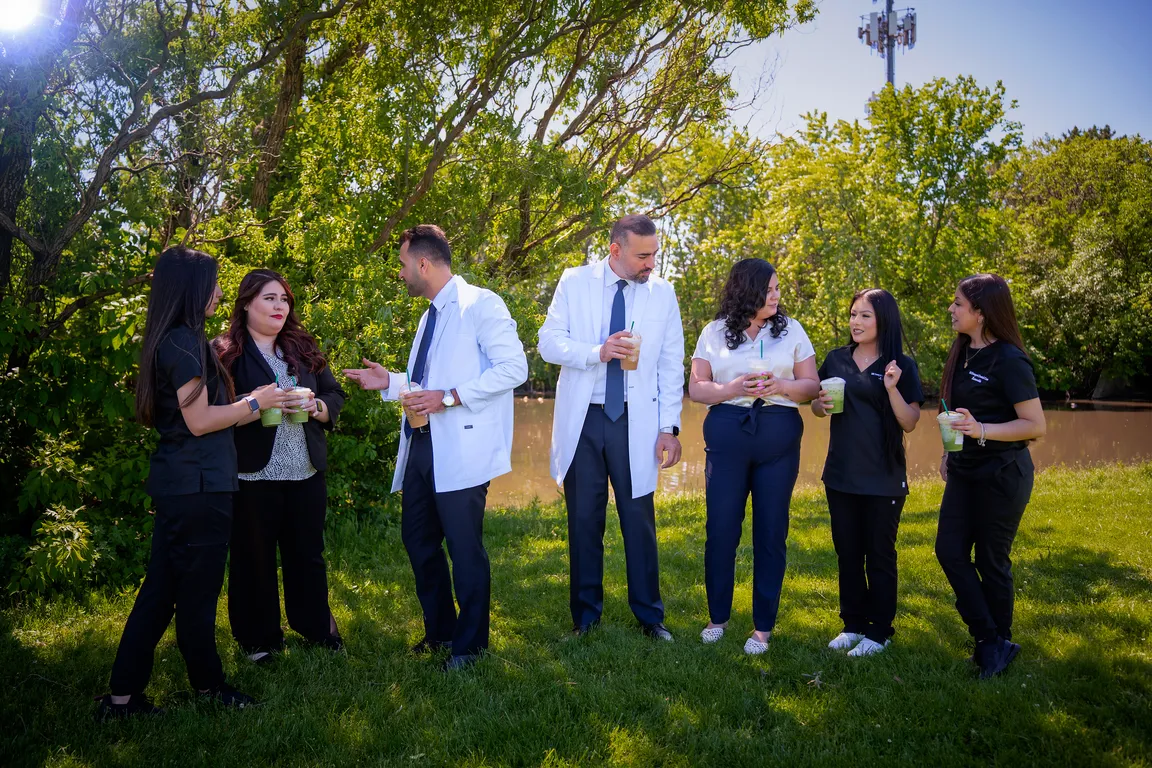 The Mount Prospect Dental Care team sharing a laugh outside the Mount Prospect, IL practice