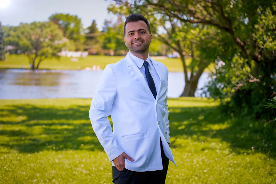 A Mount Prospect Dental Care dentist in a white coat outside the Mount Prospect, IL office