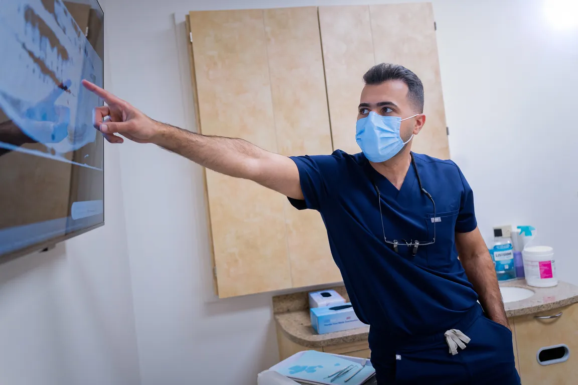 A dentist reviewing digital dental images with a patient at Mount Prospect Dental Care