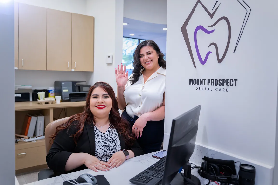 The patient care team welcoming a visitor to Mount Prospect Dental Care